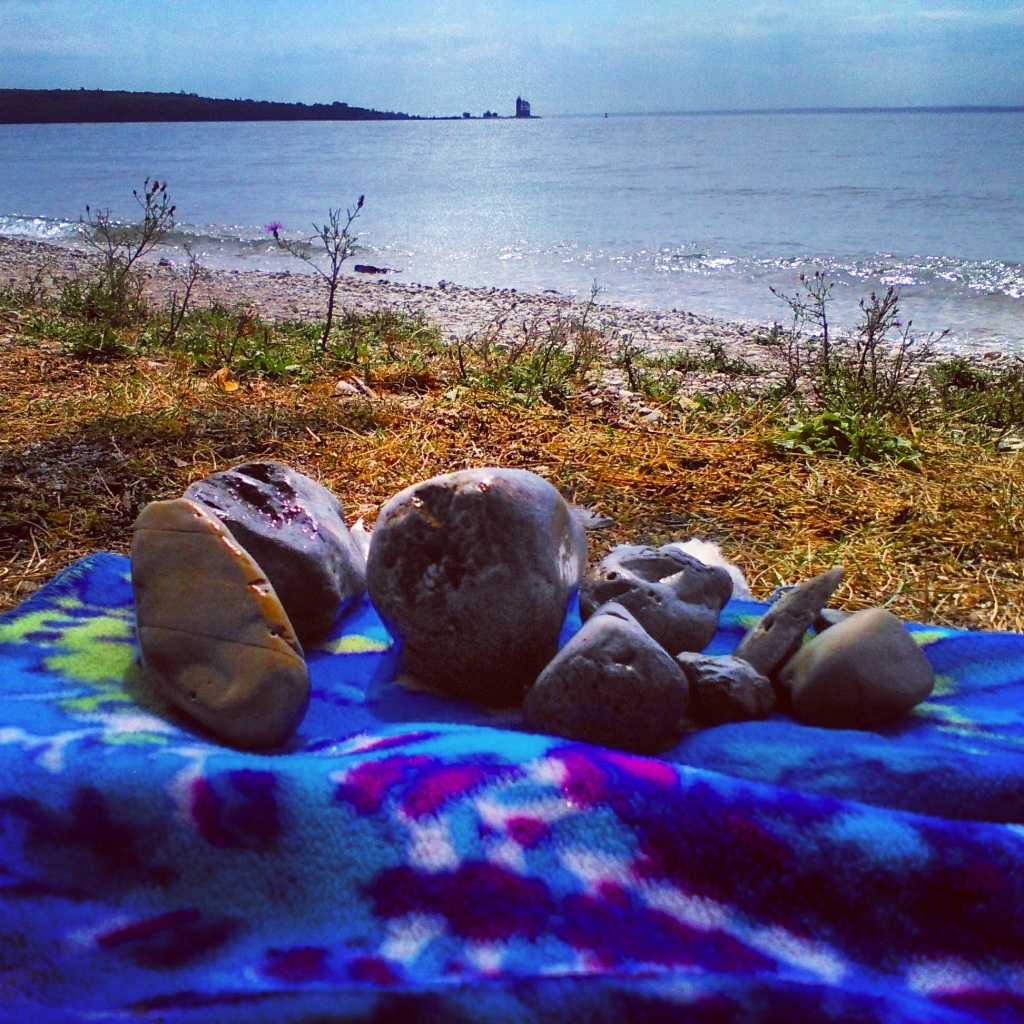 Collecting rocks on the beach of lake huron mackinac island michigan