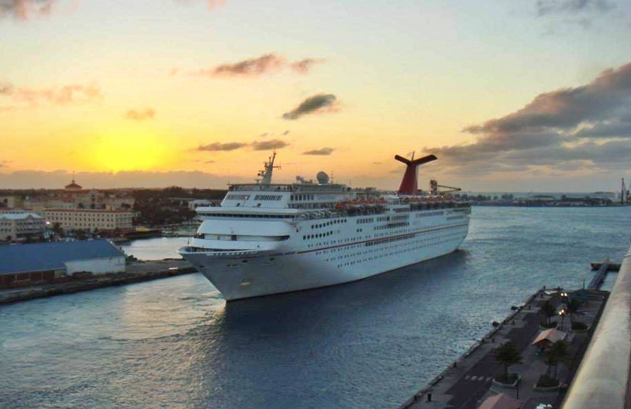 cruise ship in port at sunset